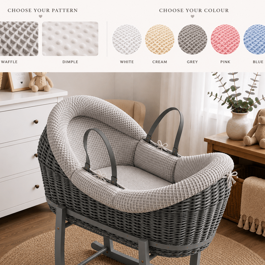 Grey wicker moses basket with padded waffle liner and carrying handles