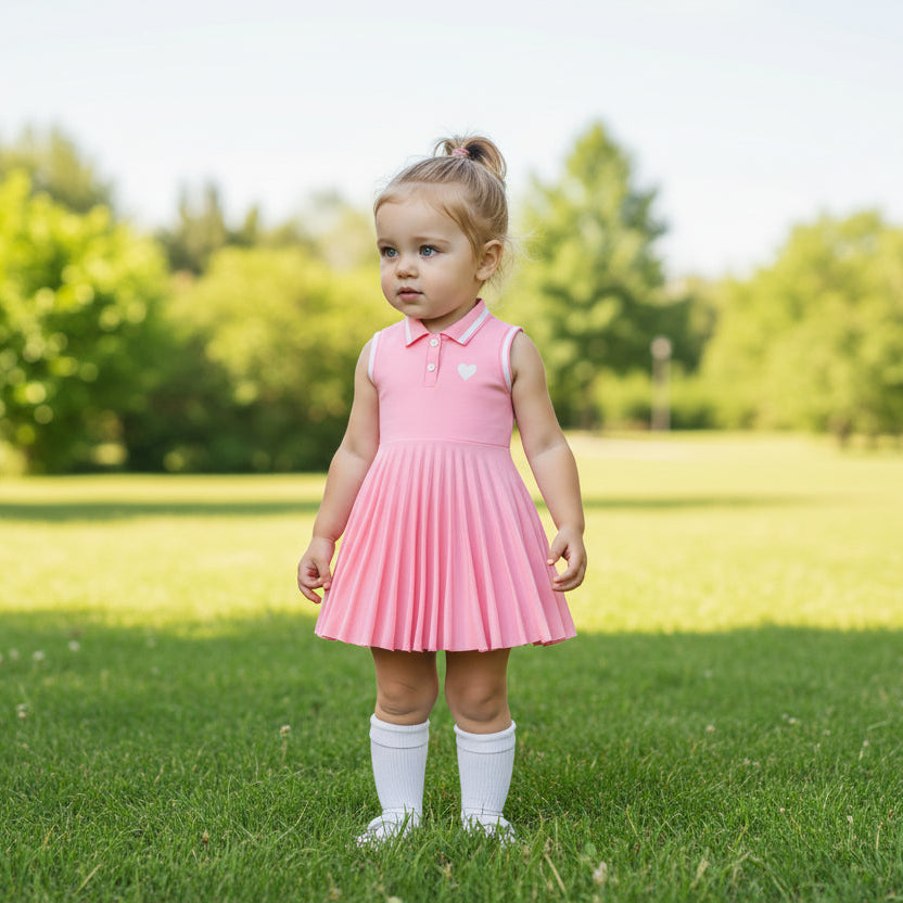 Girls' pink sleeveless polo tennis dress with collar, button placket, heart detail