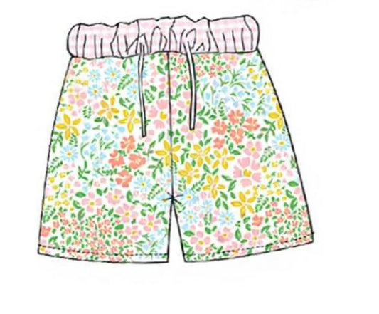Floral patterned shorts with a pink drawstring on a white background