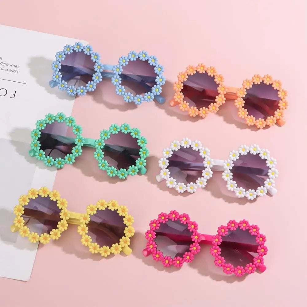 Daisy flower round sunglasses for kids, available in multiple colors, featuring UV400 protection, a playful floral design, and a lightweight, comfortable fit.