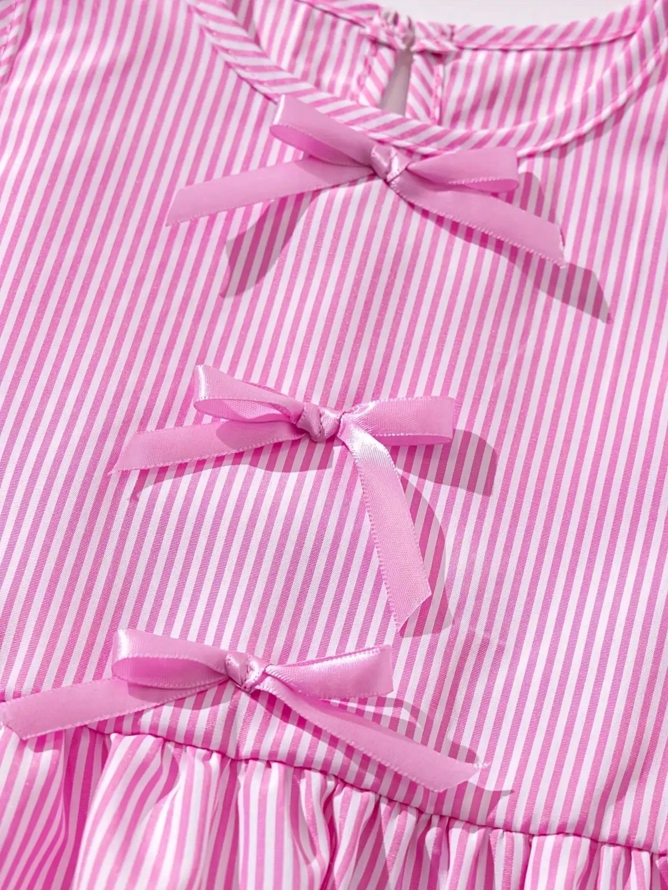 Girls pink striped top with layered ribbon bow detail