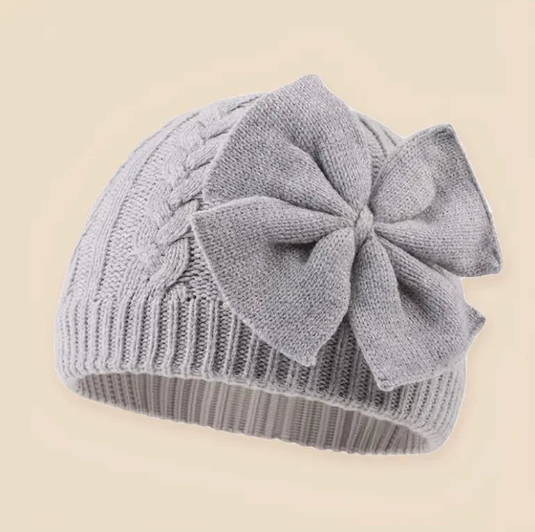 Gray knitted baby beanie hat with large bowknot and ribbed brim