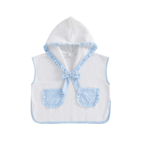 Kids hooded towel poncho in white with blue striped hood trim, bow, and pocket flaps