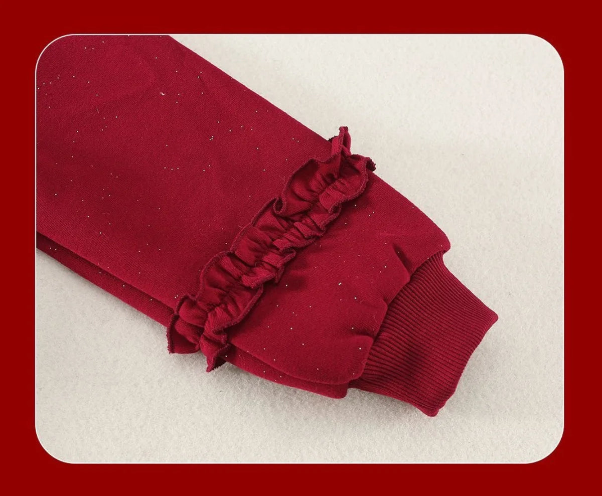 Girls red velvet dress with ruffled front detail and ribbed cuffs