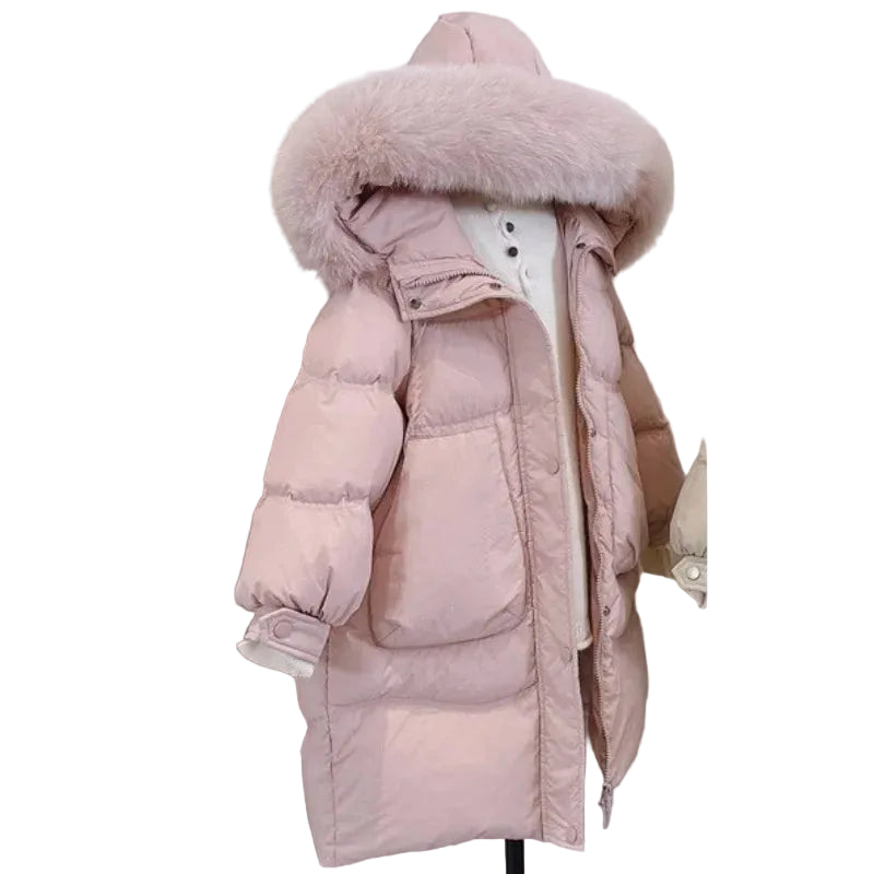 Pink girls winter hooded puffer coat with faux fur hood trim and long length.
