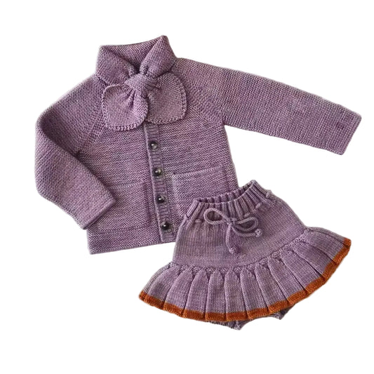 Girls purple knit cardigan with bow, matching knit skirt with orange trim and heart detail