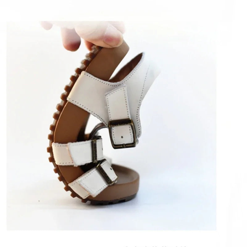 Kids white sandals with adjustable buckle straps and hook-and-loop closures