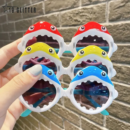 Shark polarised sunglasses for kids, available in multiple colors, featuring UV400 protection, glare-reducing lenses, and a fun shark-inspired frame.