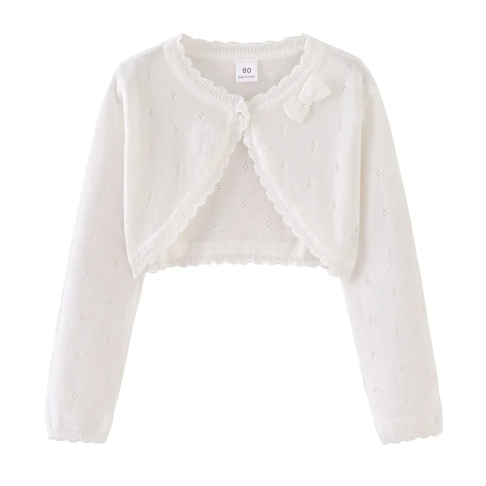 White toddler knit cardigan with bow detail at neckline and scalloped trim
