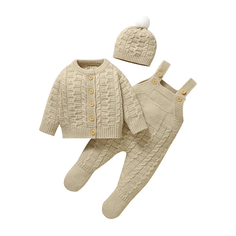 Tan knitted baby outfit set with button cardigan, romper, and pom-pom hat