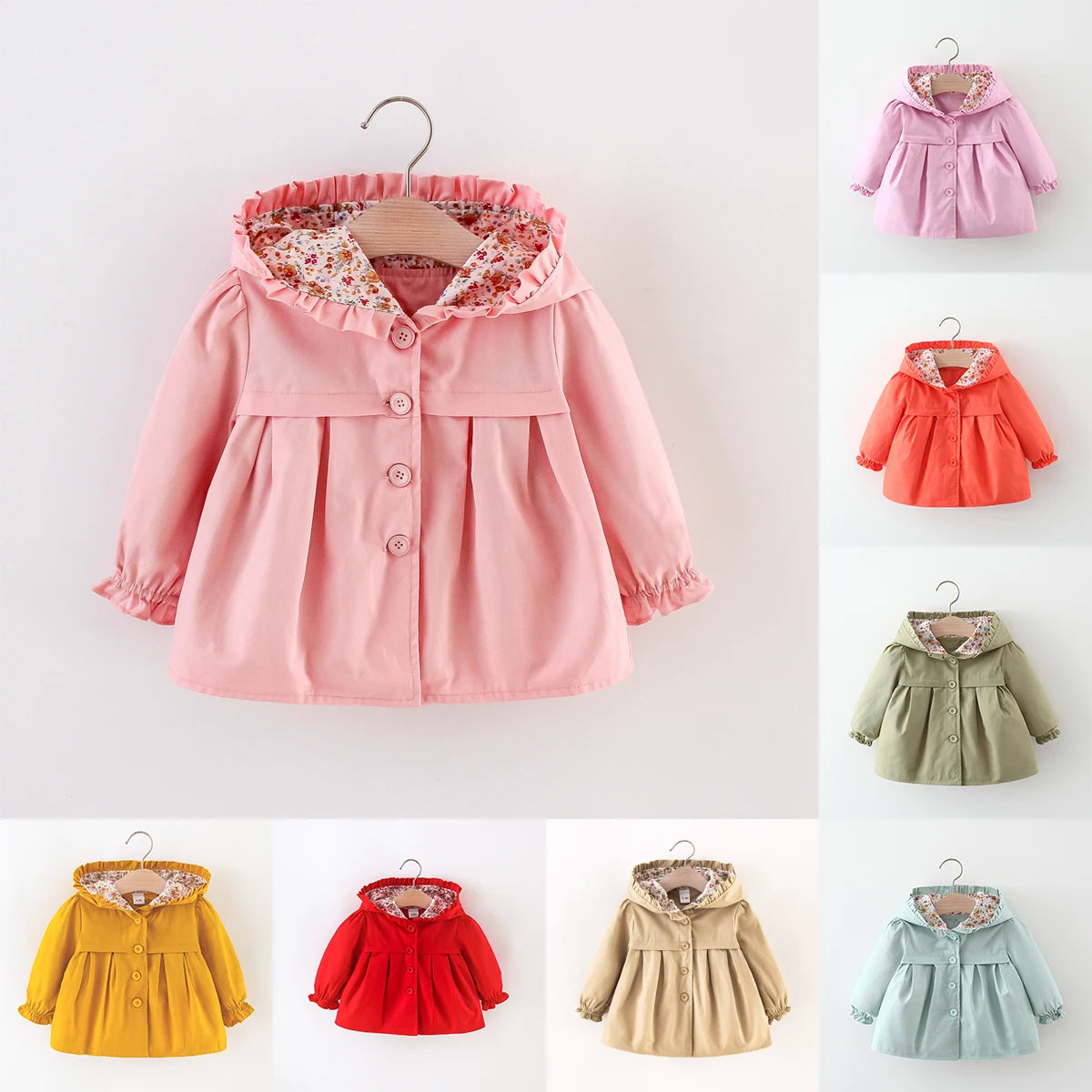 Baby hooded jacket in light pink with button front, ruffled hood, and floral lining.