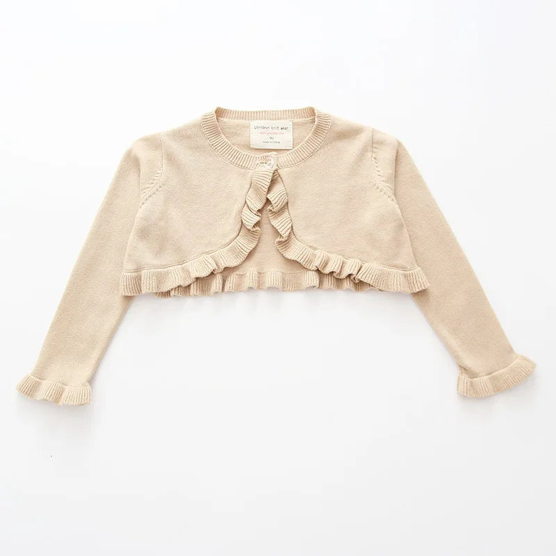 Cream toddler knit cardigan with bow tie at neck and ruffled front trim