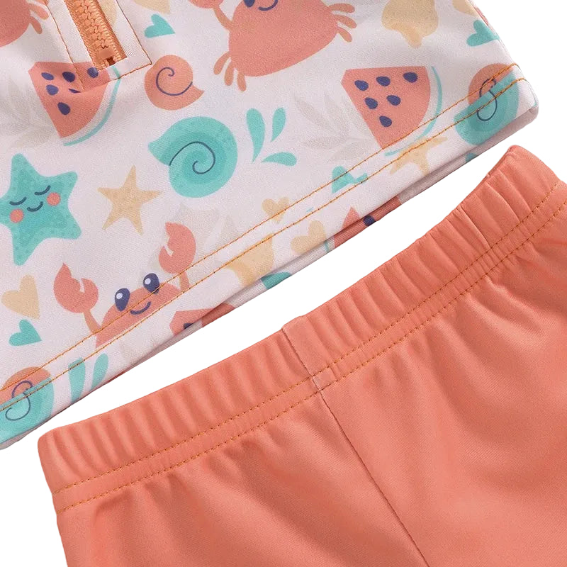 Children's shorts with a colorful sea-themed pattern on a light gray background