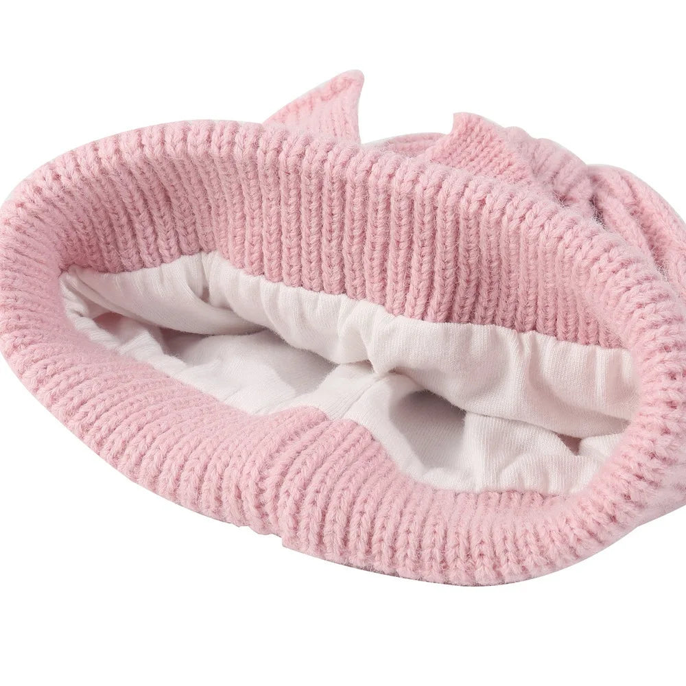 Pink knitted baby beanie hat with bowknot and white inner lining