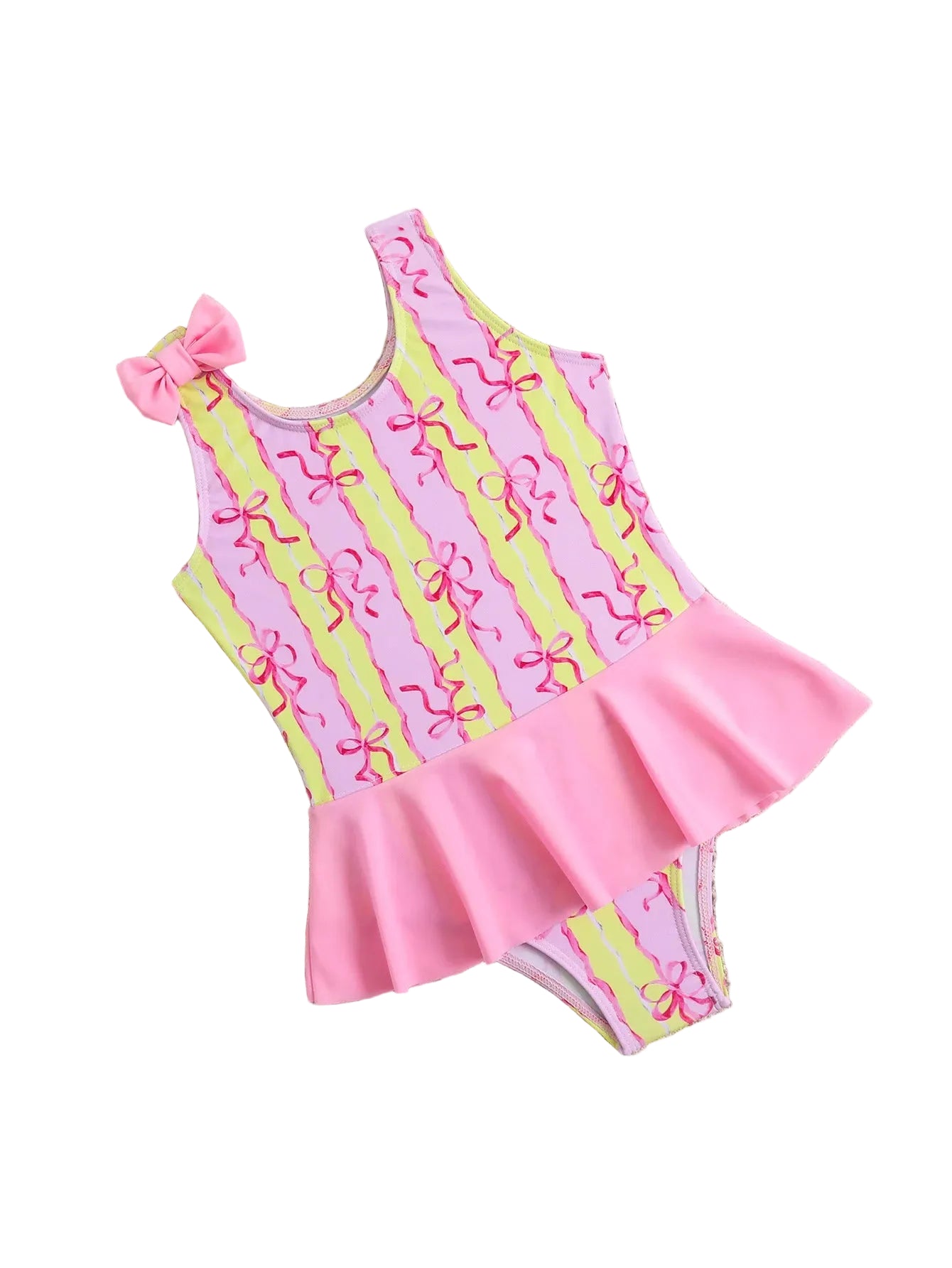 Pink and green swimsuit with bow details on a textured surface