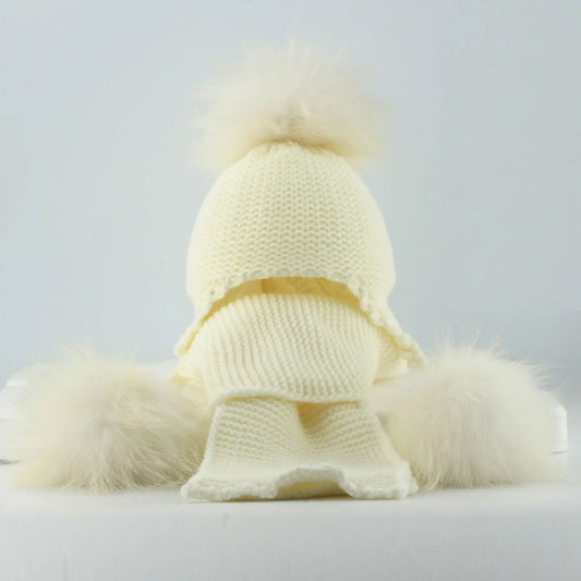 White knit raccoon hat with big pom and faux-fur scarf wrap