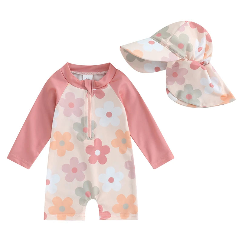 Baby swimsuit with floral pattern and matching hat on a white background
