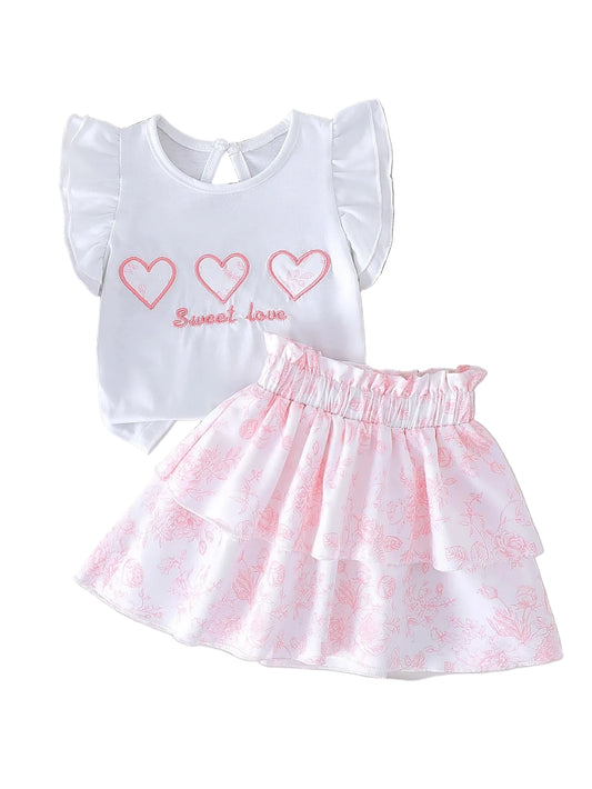 Toddler girls white top with heart outlines and “Sweet love”, paired pink tiered skirt