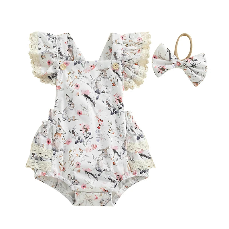 Floral baby romper with ruffles and matching headband on a white background