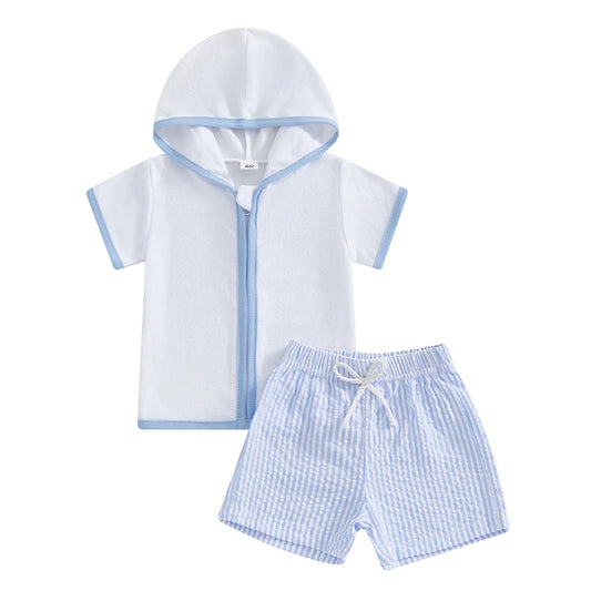 Children's hooded towel and checkered shorts set on a white background