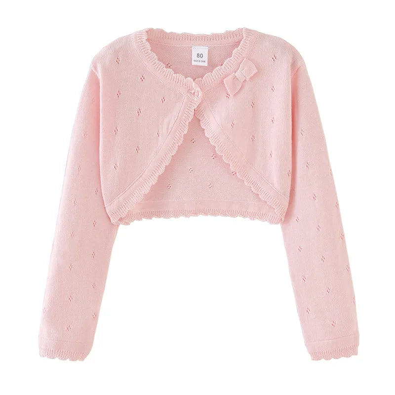 Blush pink toddler knit cardigan with bow detail at neckline and scalloped trim
