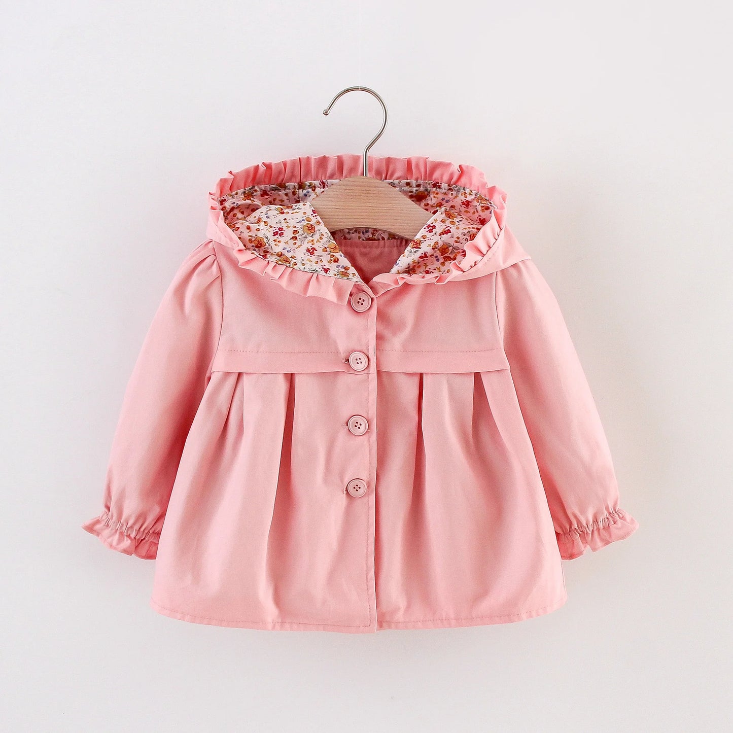 Baby light pink hooded jacket on hanger with floral-lined hood and button placket.