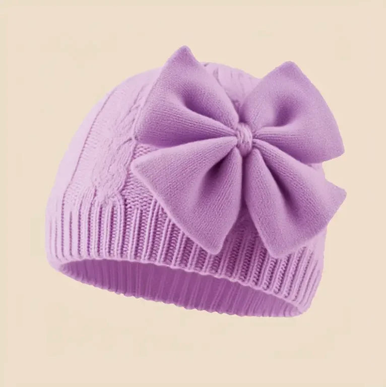 Purple knitted baby beanie hat with large bowknot detail