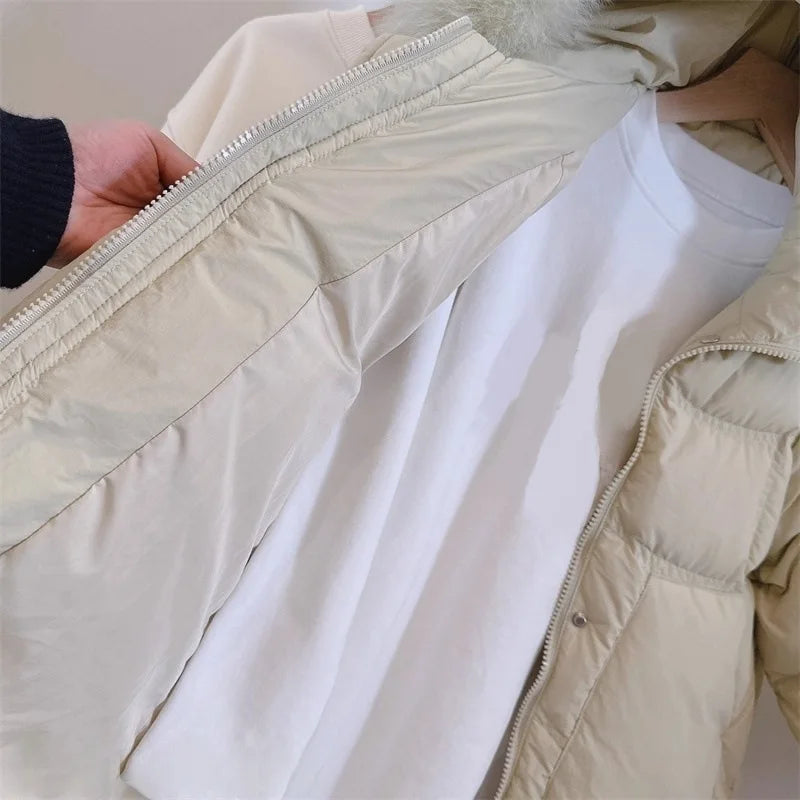 Light cream/white hooded puffer jacket with zip front, quilted panels, and ribbed cuff hem