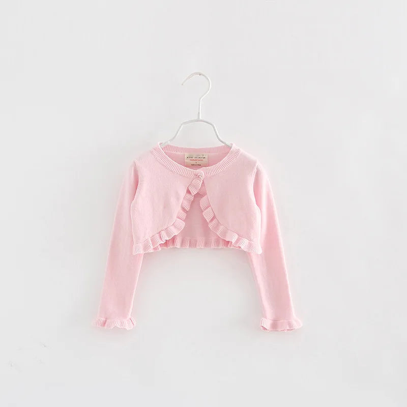 Kids knit cardigan, light pink long sleeves, cropped with bow-tie ruffle front and button