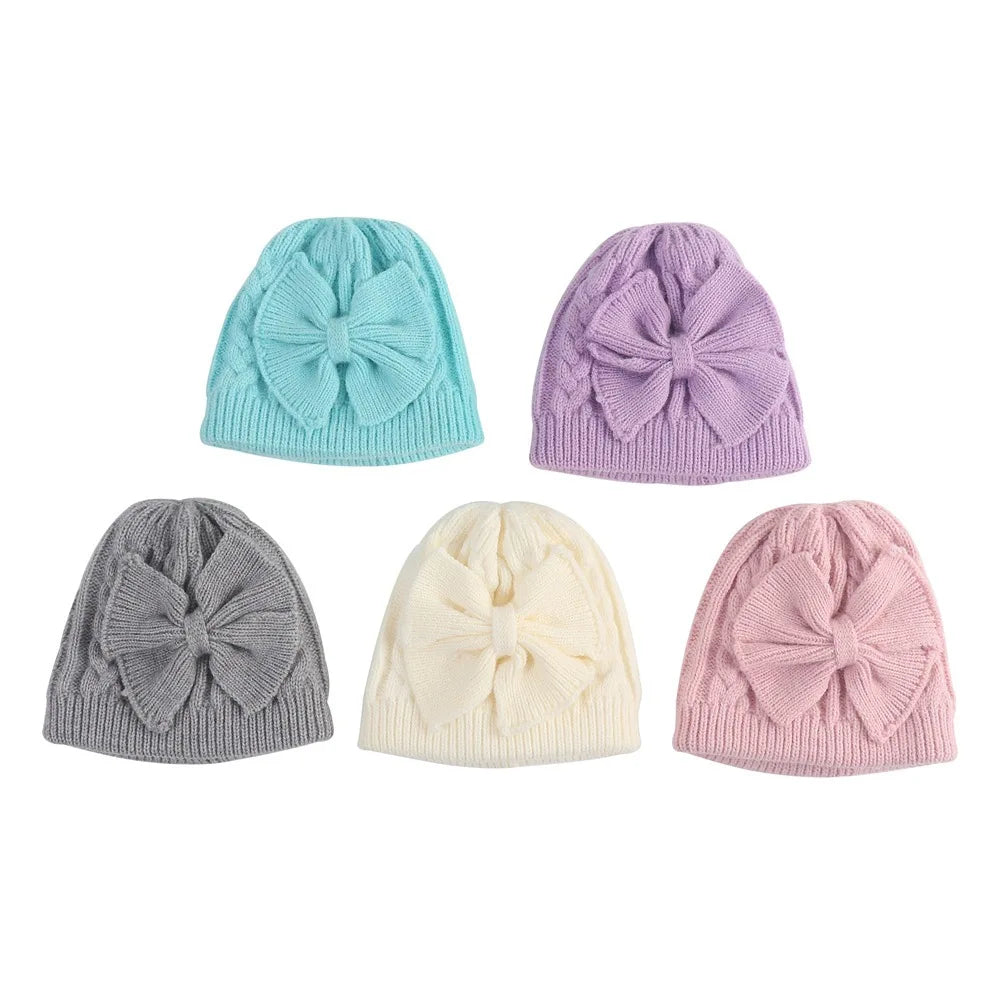 Set of kids knitted beanie hats with bowknot in blue, purple, gray, beige, pink
