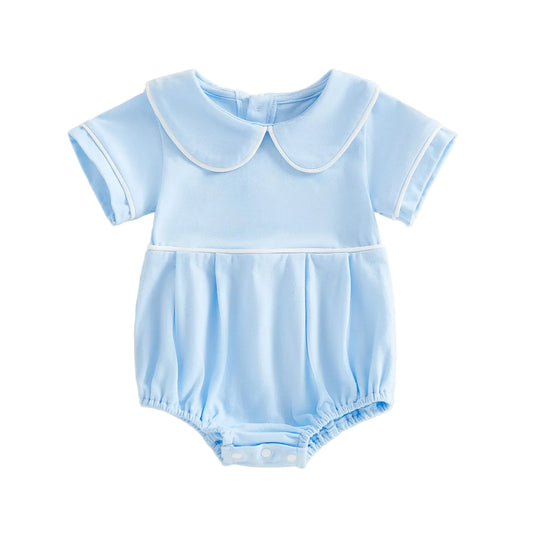 Light blue baby romper with a collar on a beige background