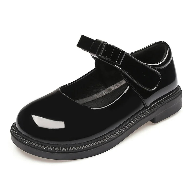 Black shiny shoe with a strap on a white background
