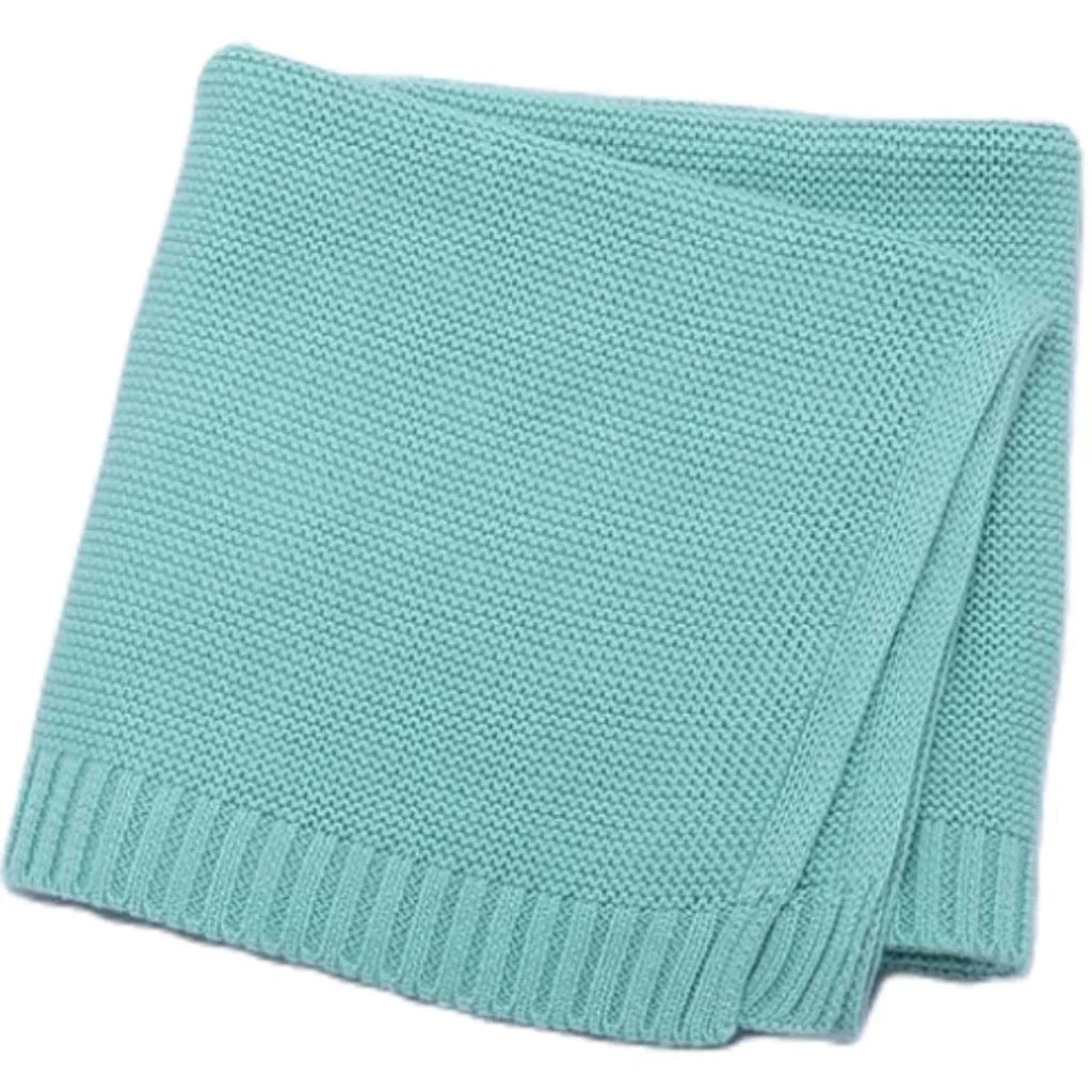 Baby knitted swaddle blanket in light aqua blue with ribbed bottom edge