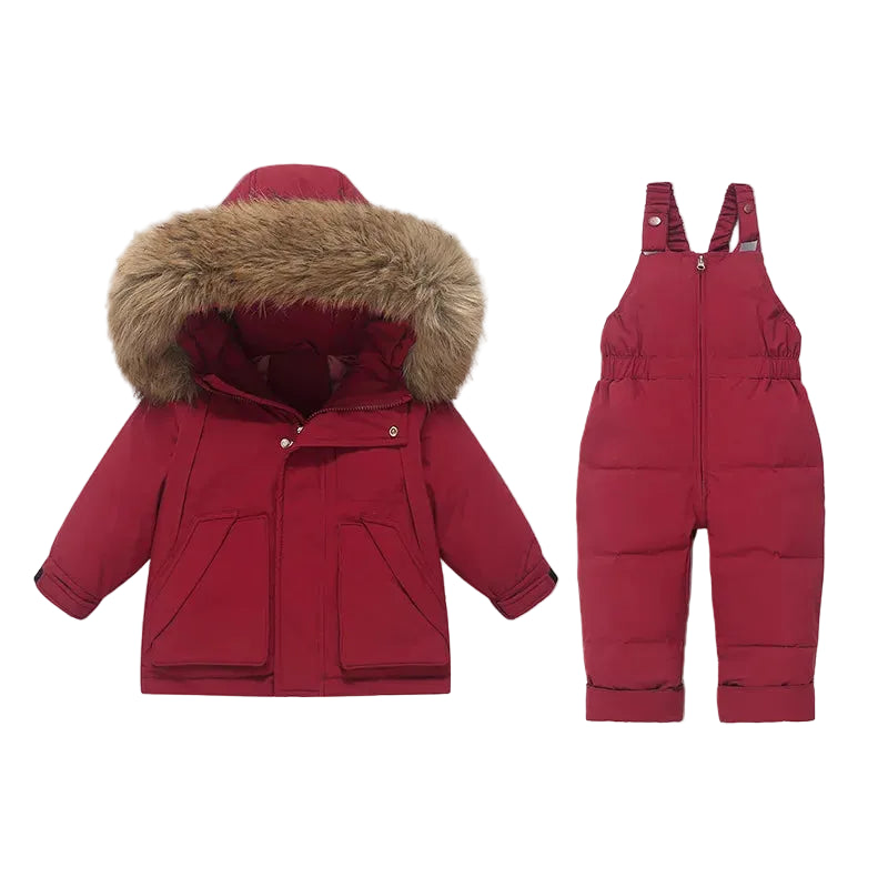 A children's winter outfit set consisting of a red hooded puffer jacket with a brown faux-fur trim and matching red insulated bib overalls, displayed on a light gray background.