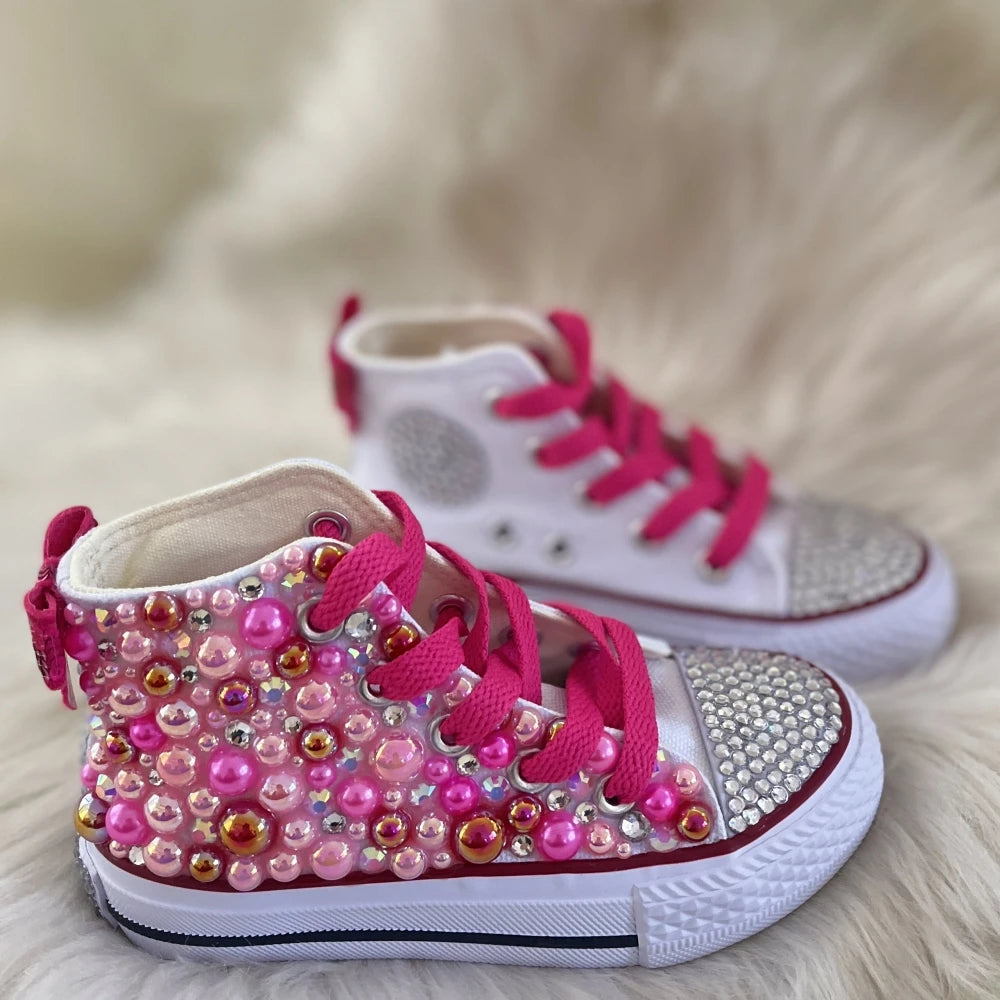 Fuchsia high-top canvas sneakers with bead and pearl embellishment, lace-up.