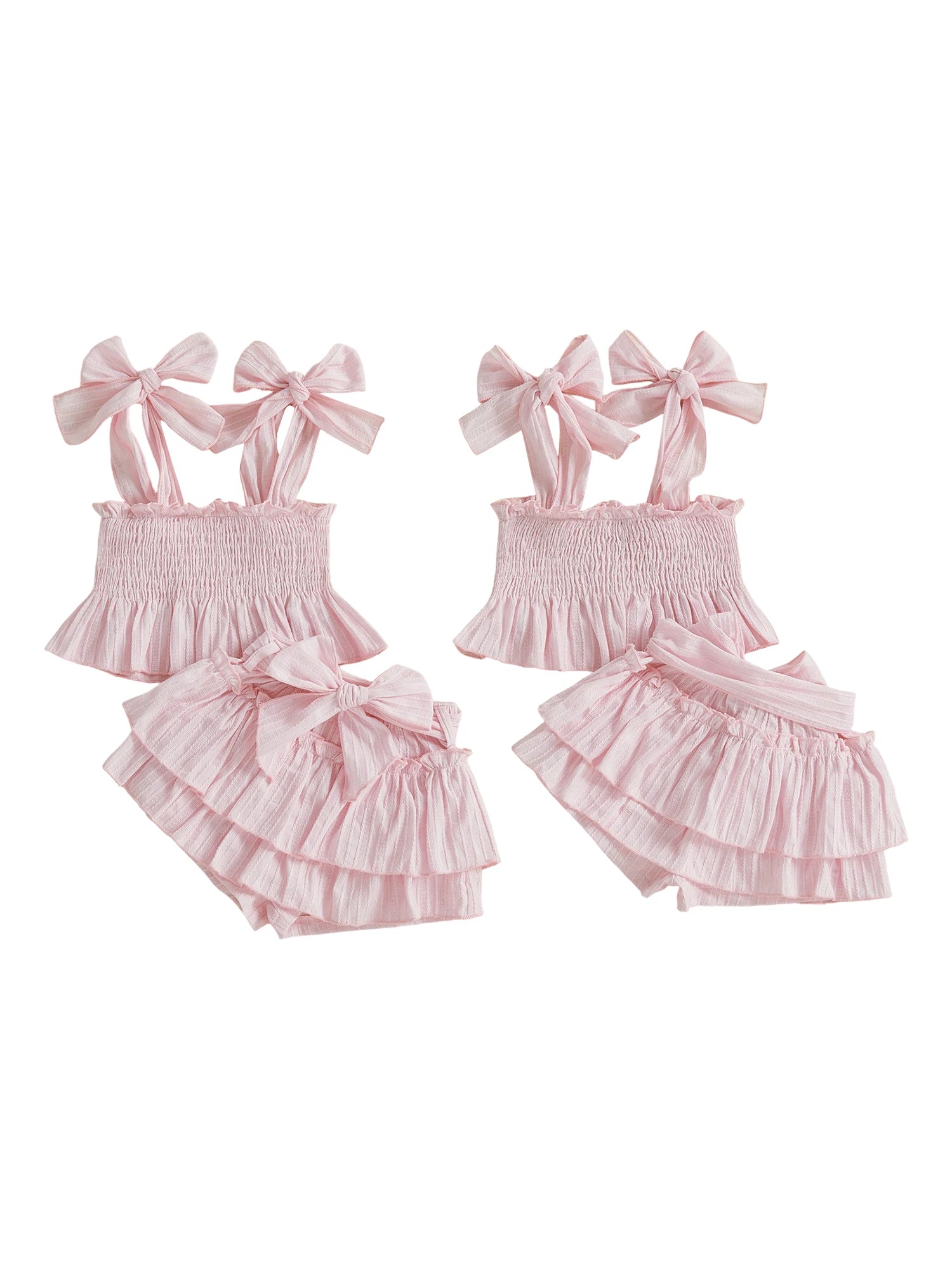Girls baby pink bow shorts set, two-piece set shown flat: ruffled cami and tiered shorts