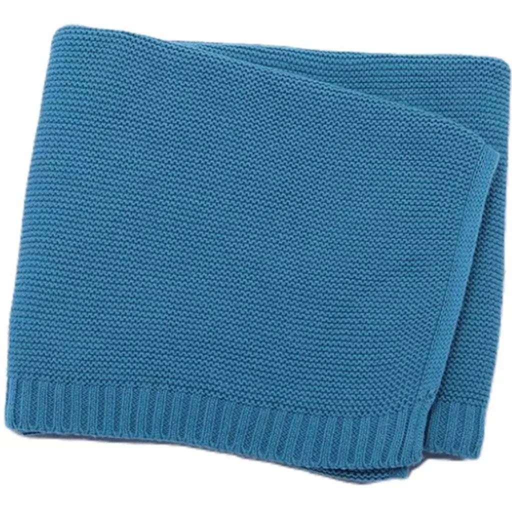 Baby knitted swaddle blanket in teal blue with ribbed bottom edge