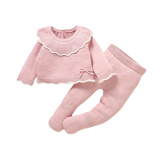 Pink 2-piece infant sweater and leggings set with scalloped ruffle and bow