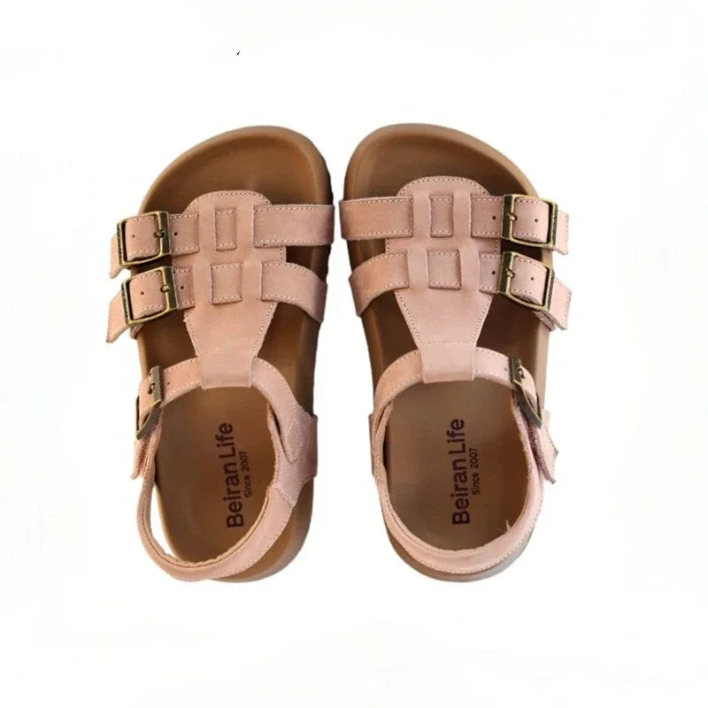 Kids pink leather sandals with buckle straps and supportive toe straps