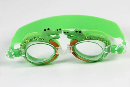 Green swimming goggles with a crocodile-themed design, anti-fog lenses, UV protection, and an adjustable strap for a secure and comfortable fit.