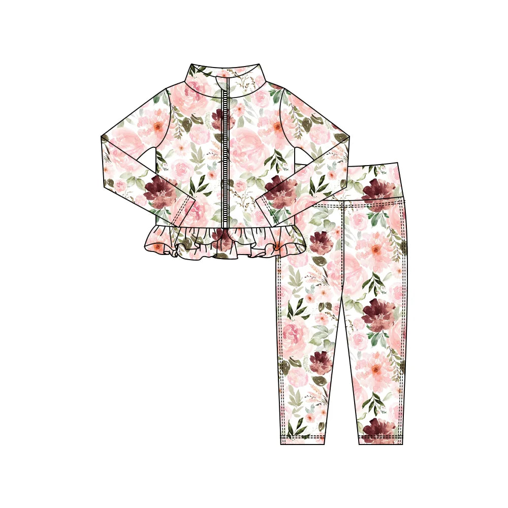 Girls blush rose floral tracksuit set with frill zip jacket and matching leggings displayed flat.