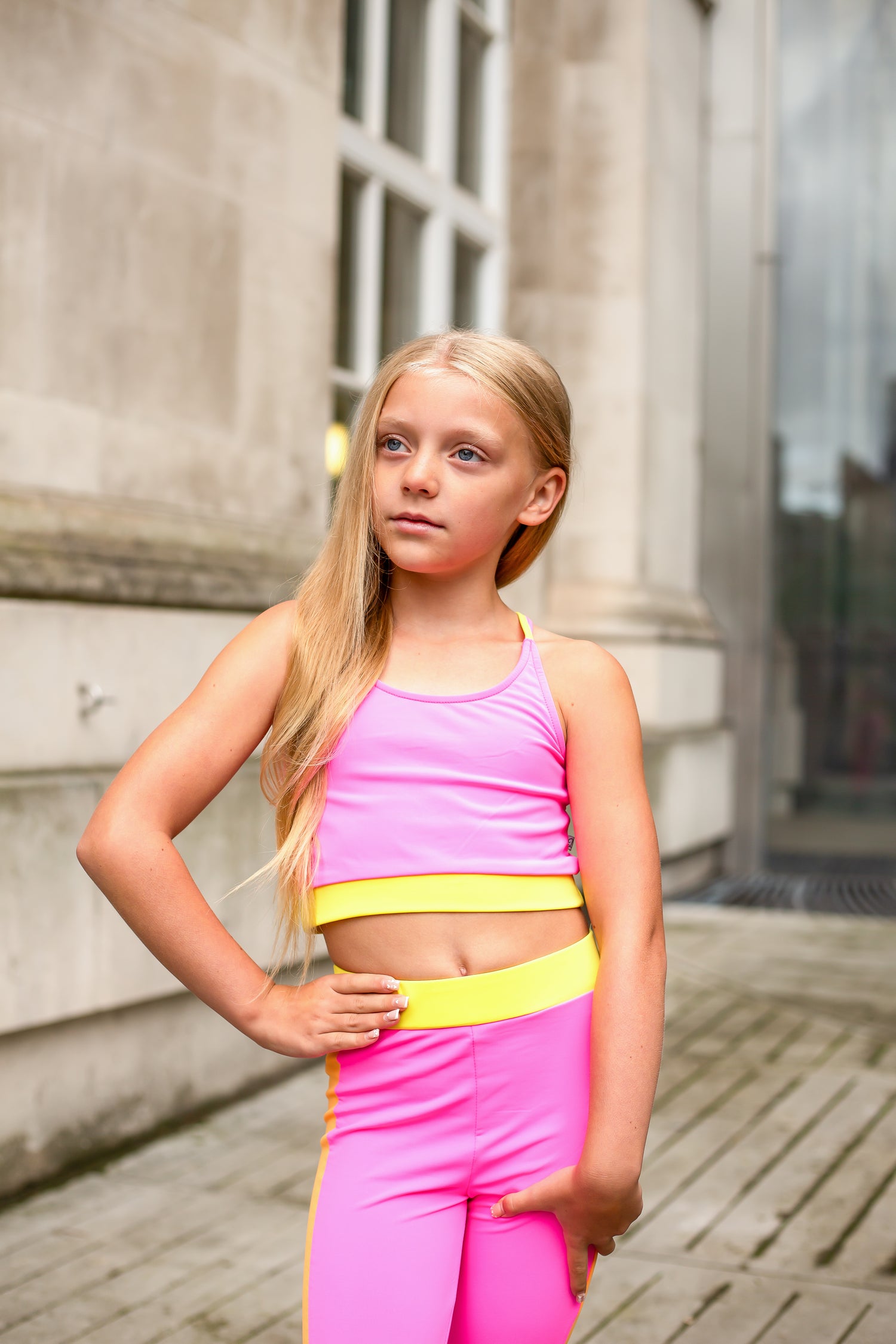 Pink crop top and leggings set with yellow trim, sleeveless racerback