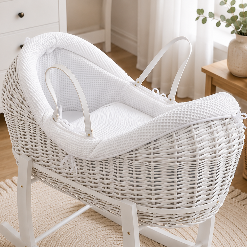 White wicker moses basket with padded waffle liner and carrying handles