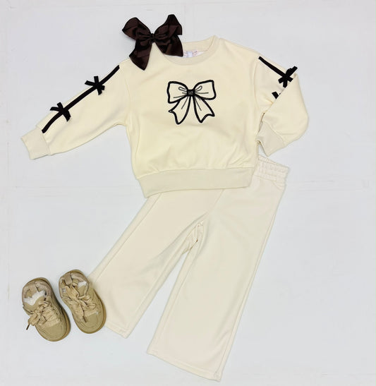 Cream toddler jogging set with black bow applique sweatshirt and matching pants