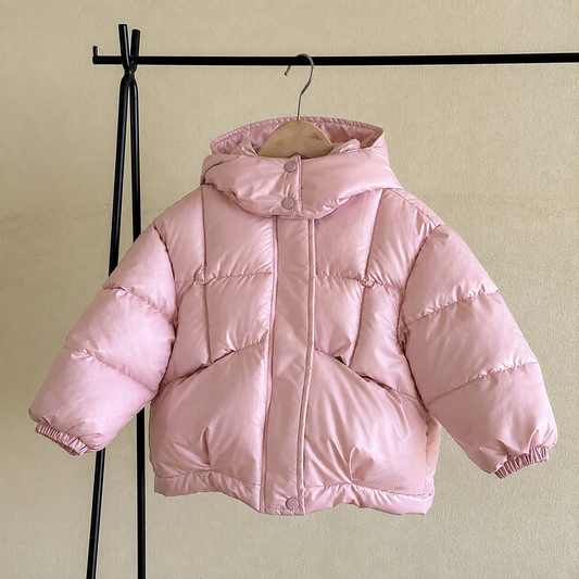 Girls pink hooded puffer coat hanging, quilted with full-zip front