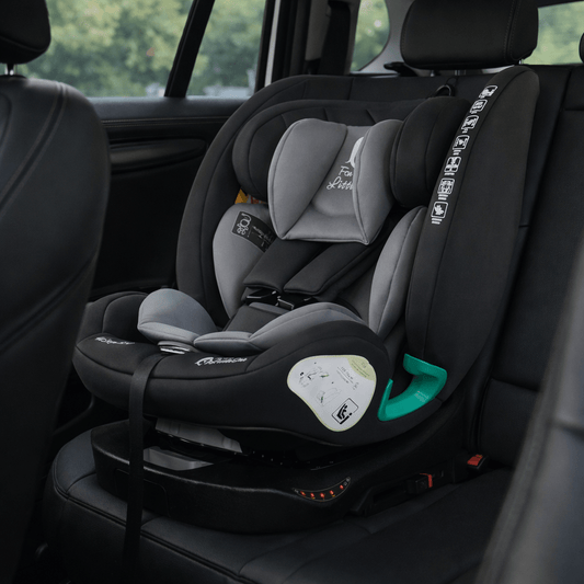 All-in-one ISOFIX car seat with light gray inserts and padded shoulder area, dark gray shell