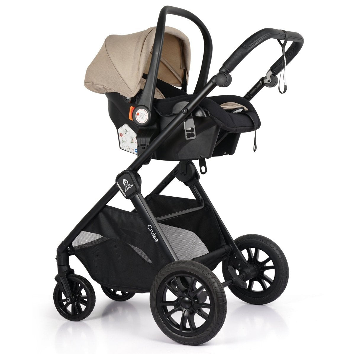 Beige infant car seat on black stroller with canopy and visible wheel suspension