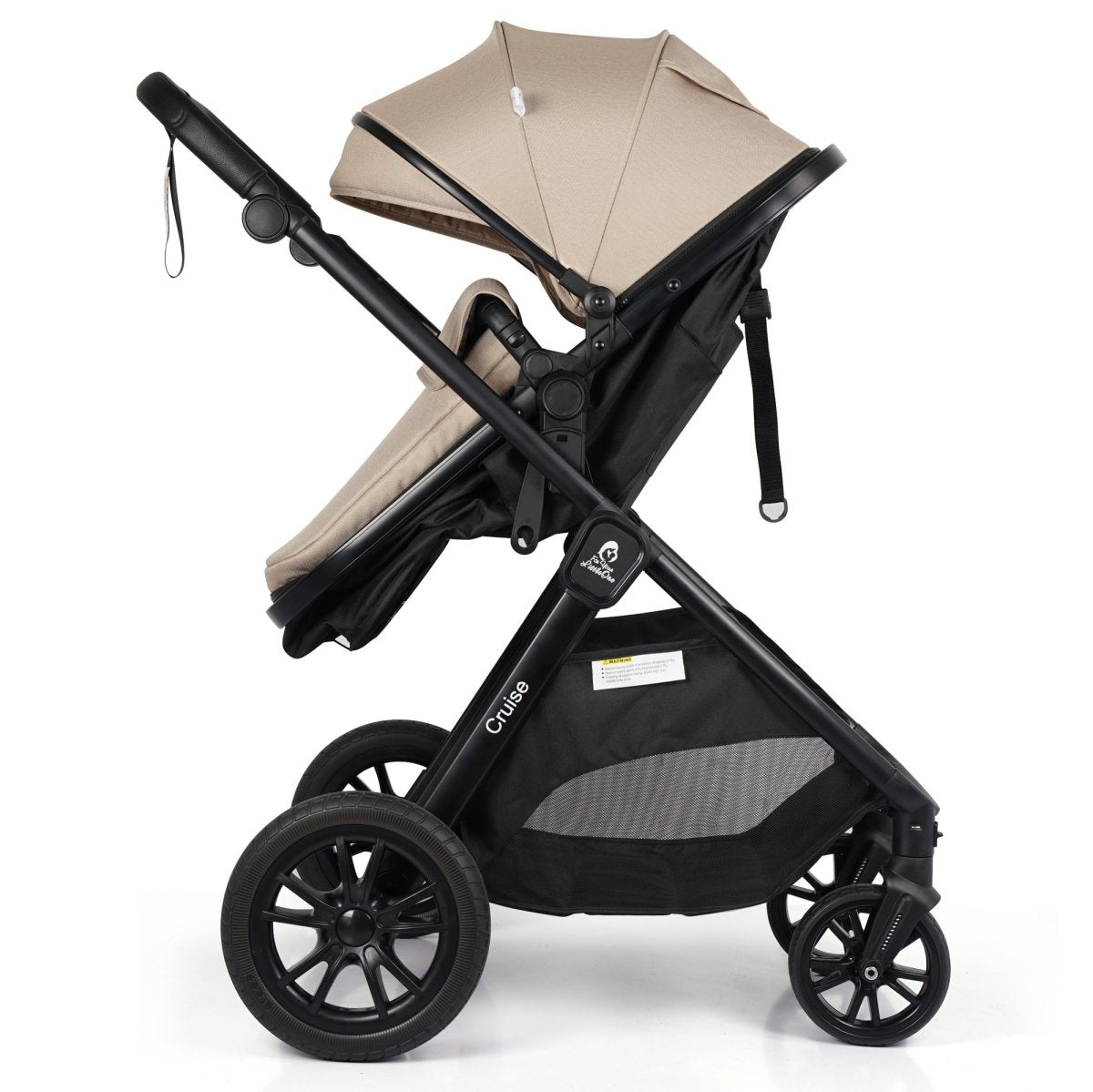 Compact stroller with beige canopy and black underbasket, angled side view
