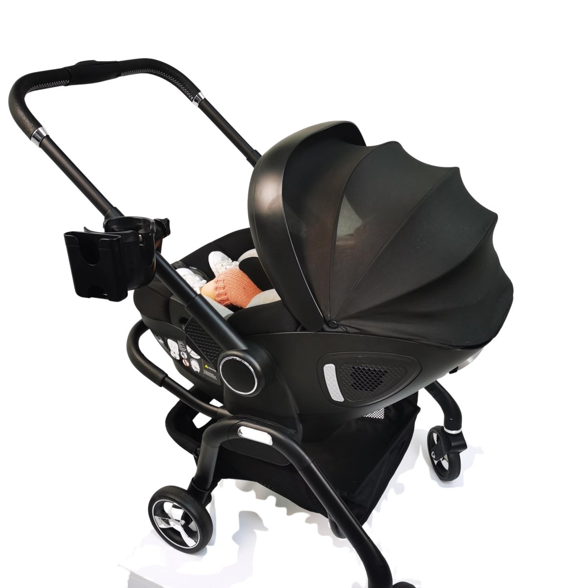 Black Qubi stroller cupholder on pushchair frame with molded cup holder