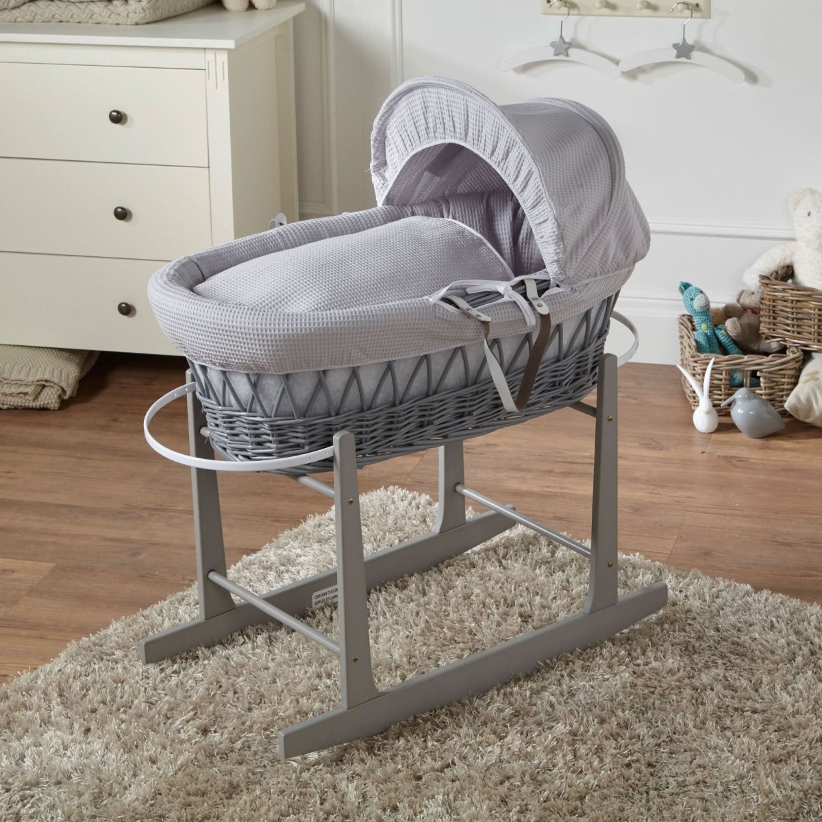 Grey waffle Moses basket with stand, woven wicker base and padded hood